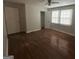 Bedroom with hardwood floors and neutral walls and two windows for ample sunlight at 1721 Lisbon Sw Dr, Atlanta, GA 30310