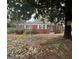 Traditional-style brick home featuring white trimmed windows and partial front yard view at 1721 Lisbon Sw Dr, Atlanta, GA 30310