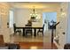 Inviting dining room featuring hardwood floors, a chandelier, and an open view to the kitchen at 235 Windcroft, Acworth, GA 30101