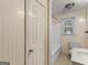 Bathroom with white fixtures, including a toilet, bathtub, and sink at 1713 Bramlett Shoals Rd, Lawrenceville, GA 30045