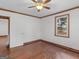 Hardwood floors, white walls, ceiling fan and a window in this bedroom space at 1713 Bramlett Shoals Rd, Lawrenceville, GA 30045