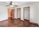 Bedroom featuring hardwood floors, closet and ceiling fan at 1713 Bramlett Shoals Rd, Lawrenceville, GA 30045