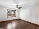 Bedroom with hardwood floors, a ceiling fan, and a window at 1713 Bramlett Shoals Rd, Lawrenceville, GA 30045