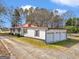 Aerial view features the roofline and long driveway leading up to the property at 1713 Bramlett Shoals Rd, Lawrenceville, GA 30045