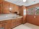 Kitchen featuring oak cabinets and view out the window at 1713 Bramlett Shoals Rd, Lawrenceville, GA 30045