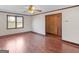 Bright living room featuring hardwood floors, a window, and a ceiling fan that provides great air circulation at 1713 Bramlett Shoals Rd, Lawrenceville, GA 30045