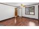 Bright living room featuring hardwood floors, a door and windows to let the light in, with neutral wall paint at 1713 Bramlett Shoals Rd, Lawrenceville, GA 30045