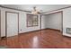 Bright living room featuring hardwood floors, a window, and a door to let the light in at 1713 Bramlett Shoals Rd, Lawrenceville, GA 30045