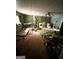 A cluttered basement needing significant cleanup and organization and a ceiling fan at 3210 Rogers Rd, Mcdonough, GA 30252