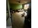 A bedroom shows extensive clutter and disrepair; full renovation recommended for appeal at 3210 Rogers Rd, Mcdonough, GA 30252