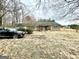 A single story home featuring a stone facade, covered porch, and a neatly landscaped front yard at 3210 Rogers Rd, Mcdonough, GA 30252