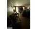 Living room needing renovation featuring older carpet and a brick fireplace at 3210 Rogers Rd, Mcdonough, GA 30252