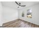 Bedroom featuring two windows, hard surface floors and a ceiling fan at 5915 Trent Walk Dr, Lithonia, GA 30038