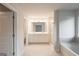 Spacious bathroom with double vanity, soaking tub, and glass-enclosed shower at 4853 Walkers Green, Mableton, GA 30126