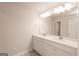 Bathroom showcasing double sink vanity with a large mirror and updated fixtures at 4853 Walkers Green, Mableton, GA 30126