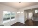 Dining room with hardwood floors, wainscotting and decorative chandelier at 4853 Walkers Green, Mableton, GA 30126