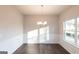 Sun-drenched dining room with hardwood floors and wainscotting details at 4853 Walkers Green, Mableton, GA 30126
