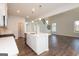 Modern kitchen with white cabinets, an island with stainless steel sink, and stainless appliances at 4853 Walkers Green, Mableton, GA 30126