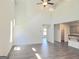 Open-concept living room with staircase and views of the kitchen at 4853 Walkers Green, Mableton, GA 30126