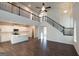 Living room view toward the kitchen, showing open concept and staircase at 4853 Walkers Green, Mableton, GA 30126