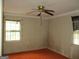 A modest bedroom with a ceiling fan and two windows to let in natural light at 1989 Grant Sw Rd, Atlanta, GA 30331