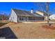 Spacious backyard with a well-maintained lawn and a patio area, great for outdoor entertaining and leisure at 227 Lantana Dr, Locust Grove, GA 30248