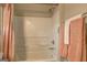 Close up shot of bathroom shower and tub, with neutral colored towels at 227 Lantana Dr, Locust Grove, GA 30248