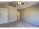 A spacious bedroom with vaulted ceiling, neutral walls, carpet flooring, and ceiling fan at 227 Lantana Dr, Locust Grove, GA 30248