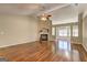 Inviting living room with hardwood floors, fireplace, a ceiling fan and an open layout for versatile living at 227 Lantana Dr, Locust Grove, GA 30248