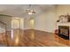 Bright living room with a fireplace, hardwood flooring, and an open concept design, perfect for Gathering gatherings at 227 Lantana Dr, Locust Grove, GA 30248