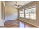 Living room with hardwood floors, ceiling fan, recessed lighting and natural light from two large windows at 227 Lantana Dr, Locust Grove, GA 30248