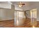 Open-concept living area featuring hardwood floors, ample natural light, and seamless flow to adjacent spaces at 227 Lantana Dr, Locust Grove, GA 30248