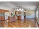 Spacious open concept living room features hardwood floors, modern appliances, vaulted ceiling and many cabinets at 227 Lantana Dr, Locust Grove, GA 30248
