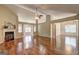 Spacious living room featuring hardwood floors, a cozy fireplace, and an open floor plan for entertaining at 227 Lantana Dr, Locust Grove, GA 30248