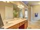 Well-lit bathroom offers a double sink vanity and ensuite access to the bedroom at 227 Lantana Dr, Locust Grove, GA 30248