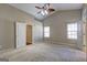 Spacious main bedroom features vaulted ceilings, carpet flooring, and natural light at 227 Lantana Dr, Locust Grove, GA 30248