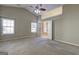 Spacious main bedroom features vaulted ceilings, ceiling fan, and access to an ensuite bathroom at 227 Lantana Dr, Locust Grove, GA 30248