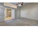 Spacious main bedroom features vaulted ceilings, neutral paint colors, and ensuite access at 227 Lantana Dr, Locust Grove, GA 30248