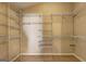 Large walk-in closet features built-in shelving and ample storage space at 227 Lantana Dr, Locust Grove, GA 30248