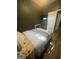 Bedroom featuring wood floors, a bed, and dark walls with mounted TV, creating a cozy and modern atmosphere at 1528 Olympian Sw Way, Atlanta, GA 30310