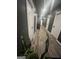 Long hallway with modern wood floors, dark walls and multiple doors, offering a glimpse into a streamlined interior at 1528 Olympian Sw Way, Atlanta, GA 30310