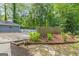 Landscaped backyard with patio and swimming pool is an oasis of privacy and beauty at 105 Oak Leaf Ct, Fayetteville, GA 30214