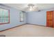 Bedroom with carpet and two windows to provide plenty of natural light and ventilation at 105 Oak Leaf Ct, Fayetteville, GA 30214