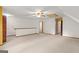 Upstairs bonus room with carpet, a ceiling fan, and access to other rooms in the home at 105 Oak Leaf Ct, Fayetteville, GA 30214