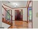 Foyer featuring hardwood floors, wooden trim and staircase at 105 Oak Leaf Ct, Fayetteville, GA 30214