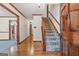 Inviting foyer with hardwood floors and a carpeted staircase at 105 Oak Leaf Ct, Fayetteville, GA 30214