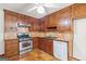 Traditional kitchen with tile countertops and stainless steel appliances at 105 Oak Leaf Ct, Fayetteville, GA 30214