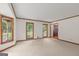 Bright living room with large windows and neutral carpet at 105 Oak Leaf Ct, Fayetteville, GA 30214