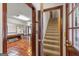 View of finished basement with terracotta floors, bar and staircase at 105 Oak Leaf Ct, Fayetteville, GA 30214