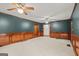 Spacious living room with hardwood trim, carpet and multiple ceiling fans at 105 Oak Leaf Ct, Fayetteville, GA 30214